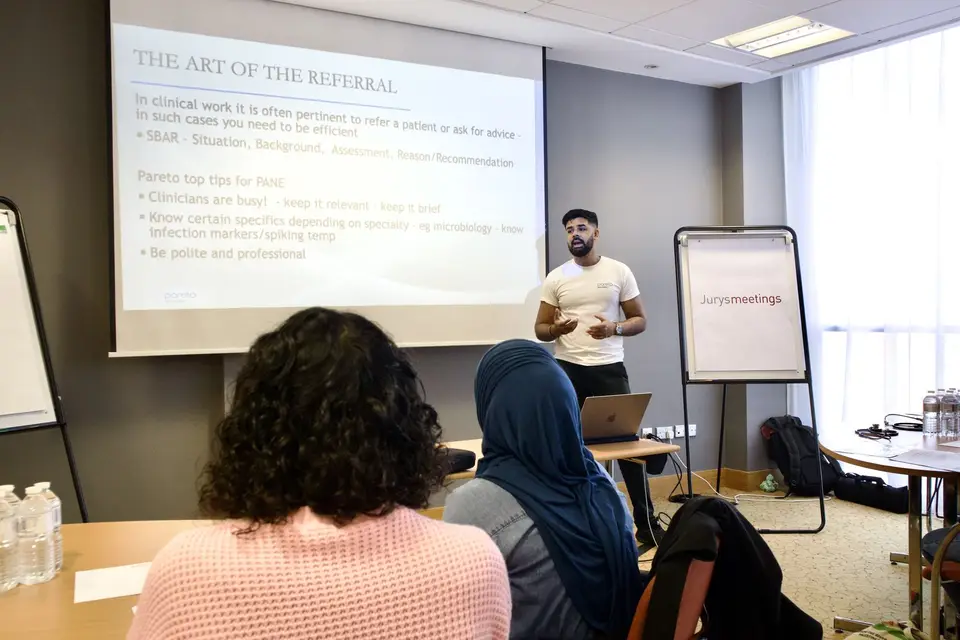 A Pareto educator teaching a room of clinicians
